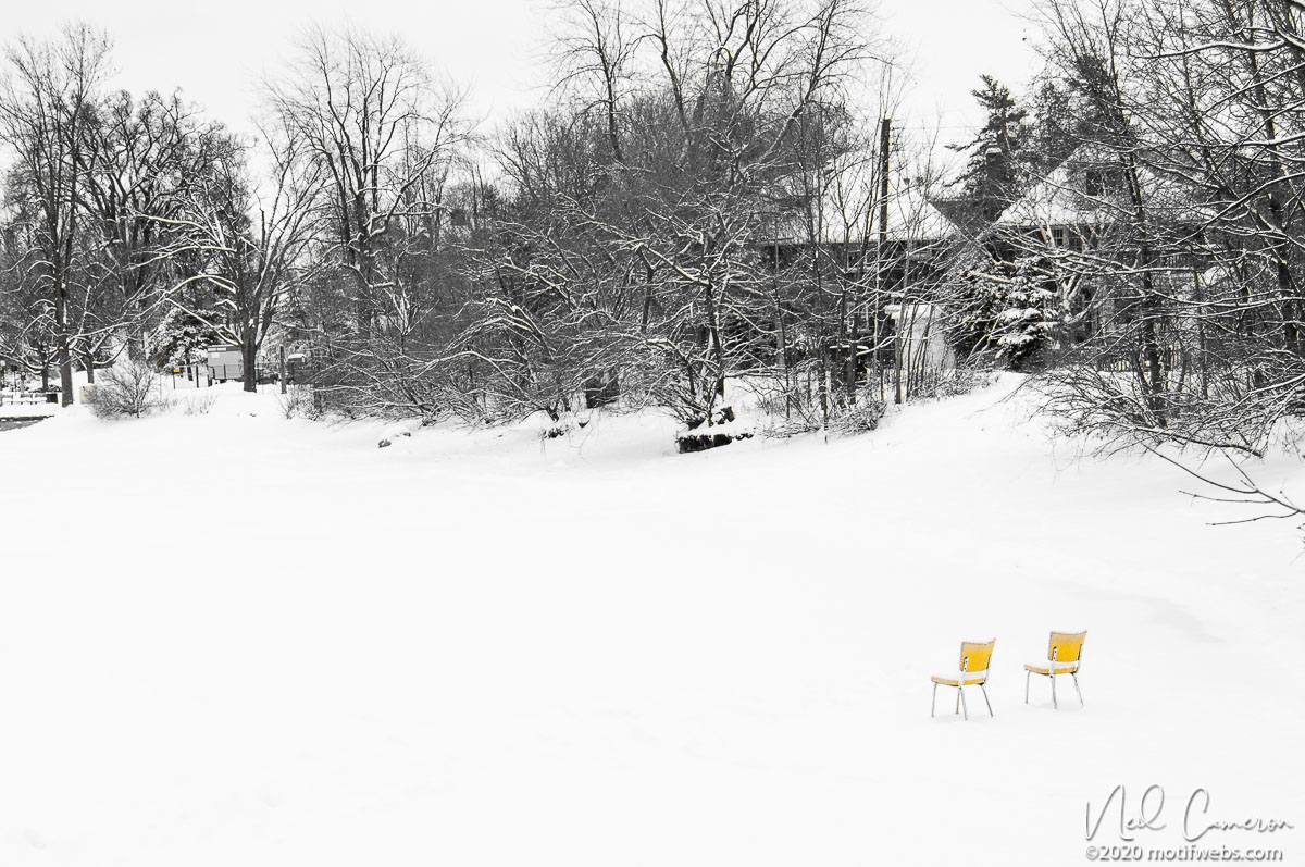 Yellow chairs on the pond